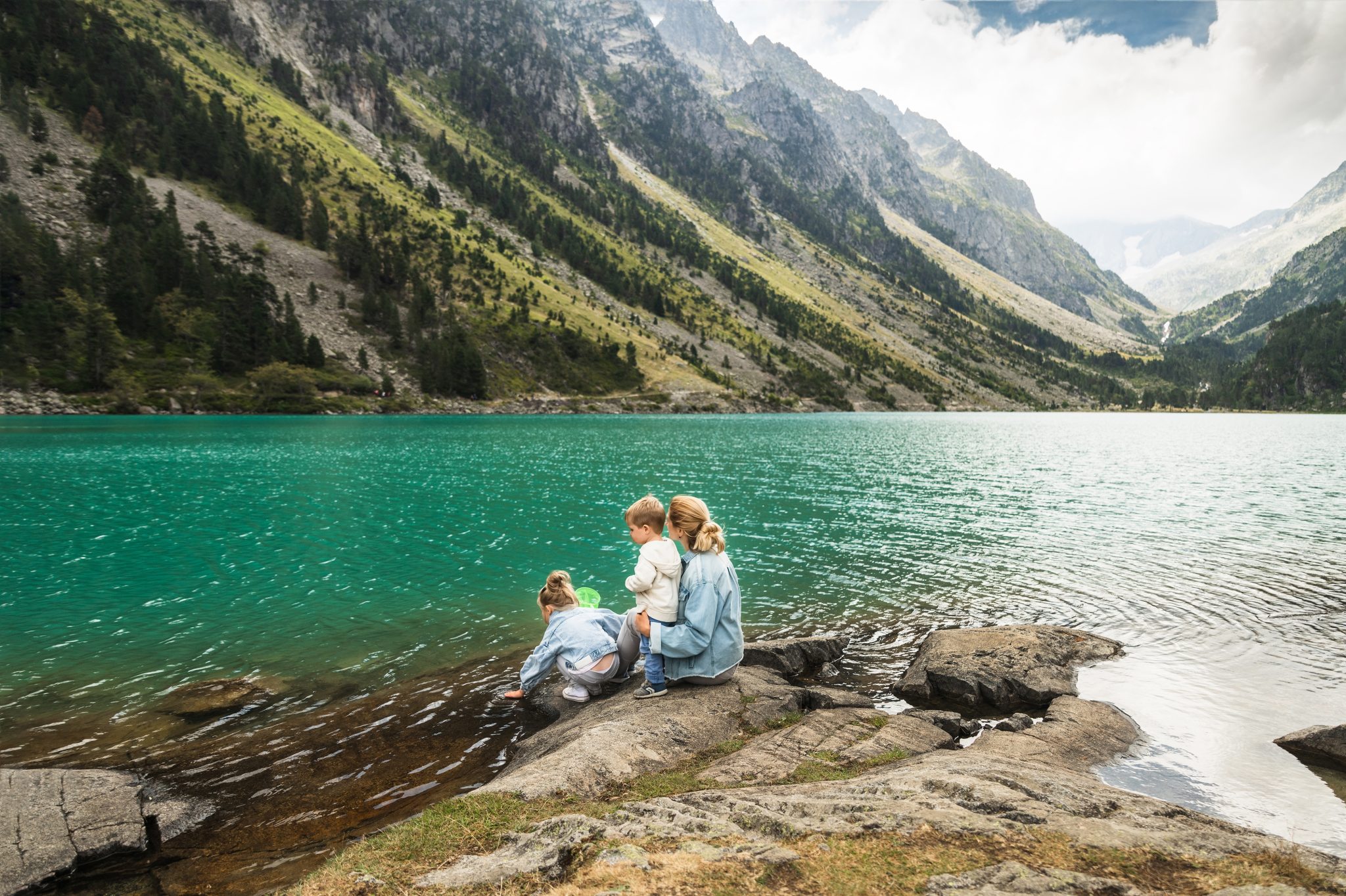 Family near a french lake Gaube in the high pyrenees